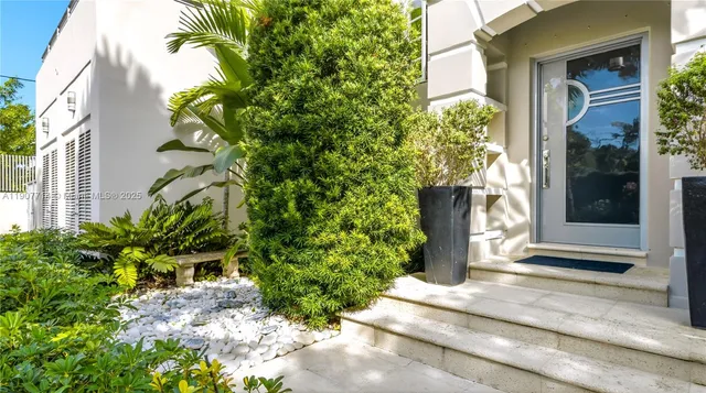 a kitchen with stainless steel appliances granite countertop a sink a stove and a microwave