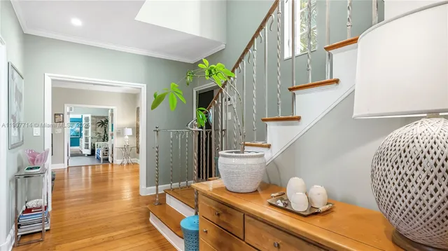 a living room with furniture a chandelier and a fireplace