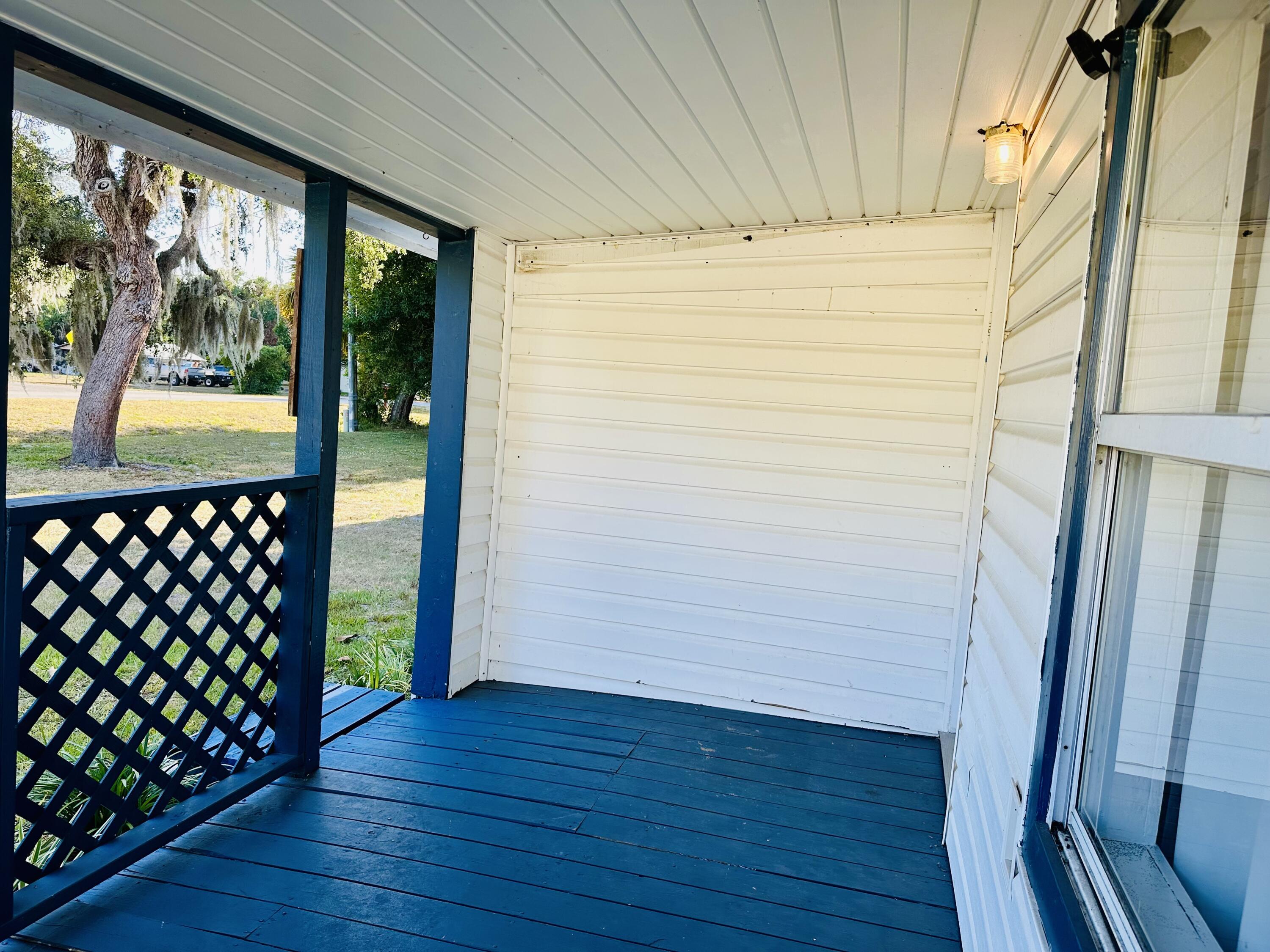 1104 Southwest 11th Street Okeechobee, FL 34974 - Photo 15 of 59 a view of a room with wooden floor and walls