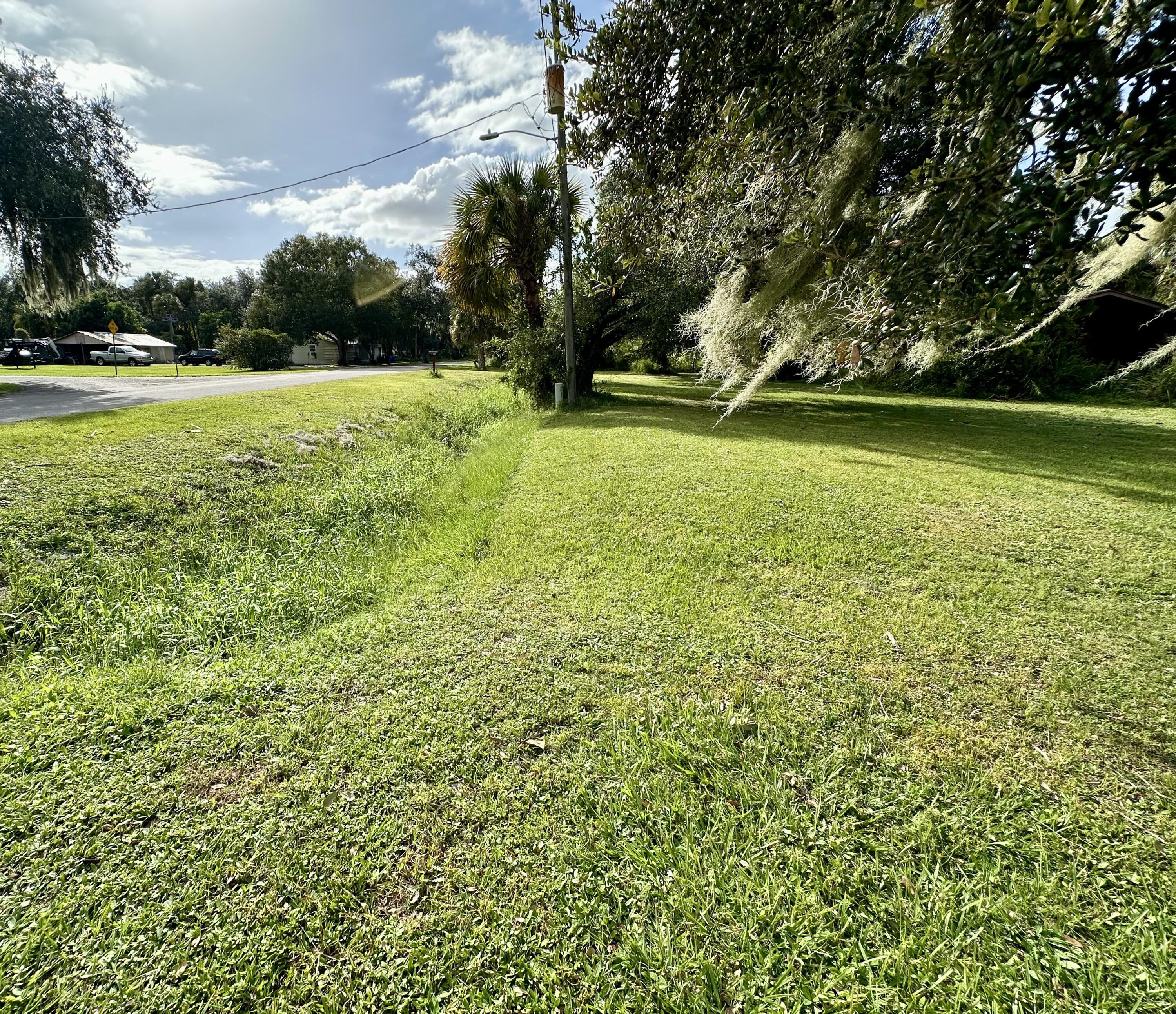 1104 Southwest 11th Street Okeechobee, FL 34974 - Photo 58 of 59 a view of yard with swimming pool and green space