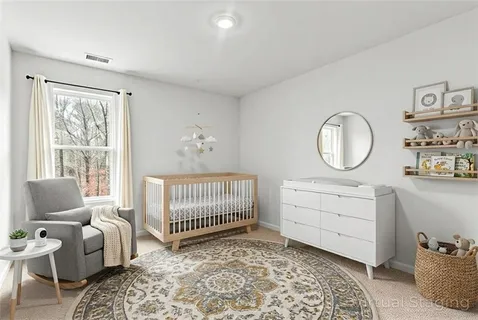 a view of a livingroom with furniture and cabinet