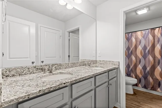 an entryway of a house and an empty room