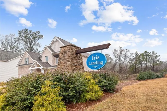a view of patio with a table and chairs under an umbrella