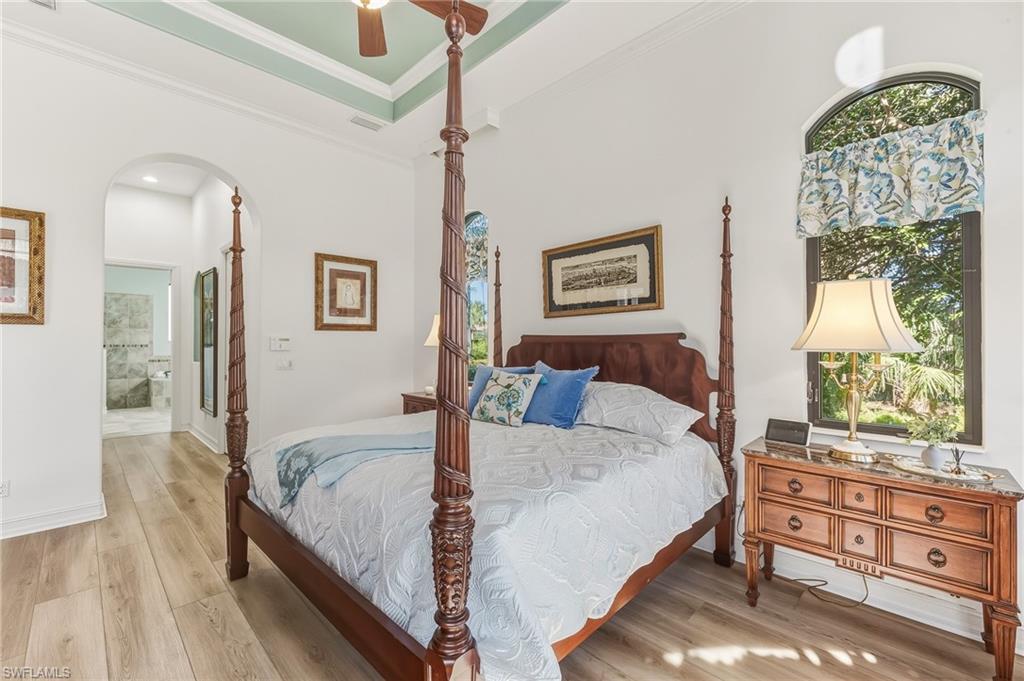 7749 Classics Drive Naples, FL 34113 - Photo 11 of 39 Primary bedroom with view to ensuite bath