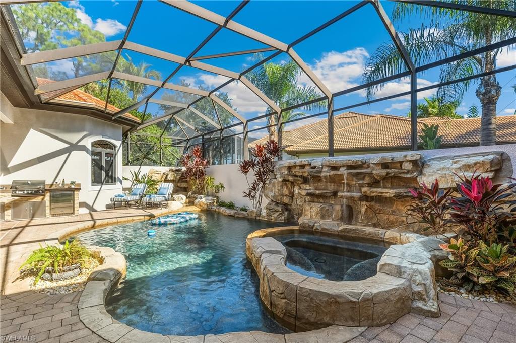 7749 Classics Drive Naples, FL 34113 - Photo 21 of 39 Custom pool with waterfalls
