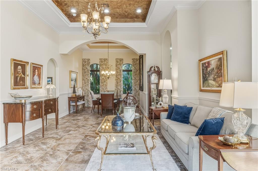 7749 Classics Drive Naples, FL 34113 - Photo 23 of 39 Living room with view to dining area