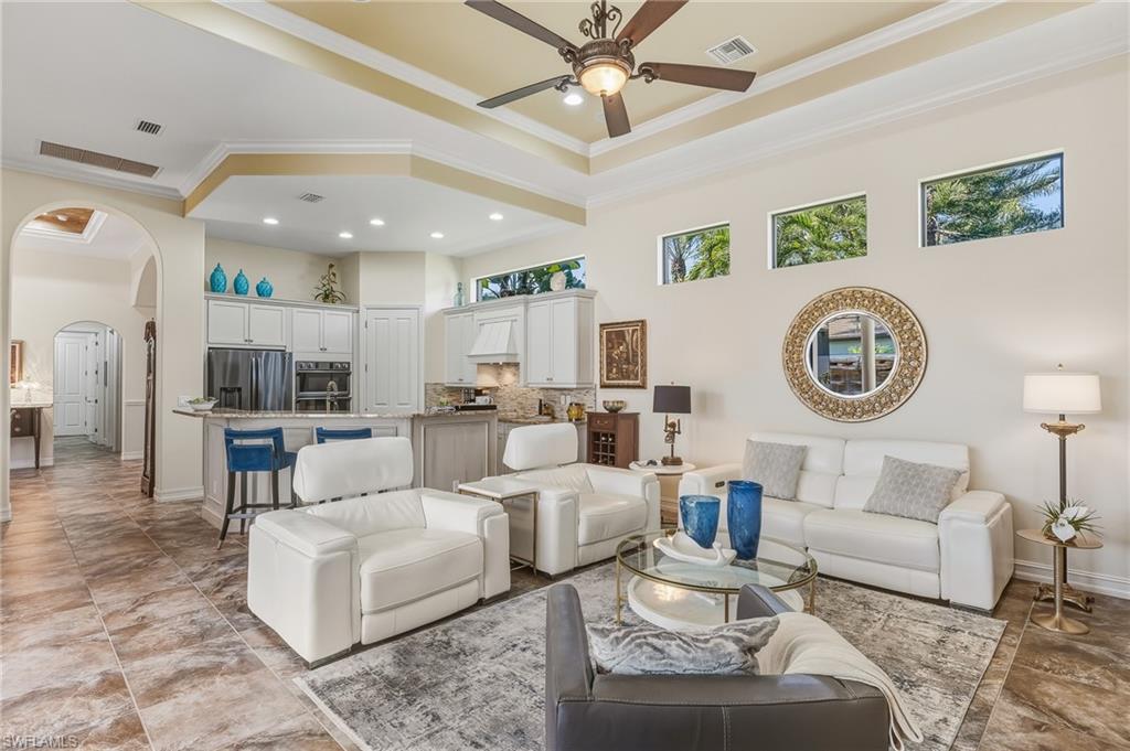 7749 Classics Drive Naples, FL 34113 - Photo 6 of 39 Family Room opens to kitchen