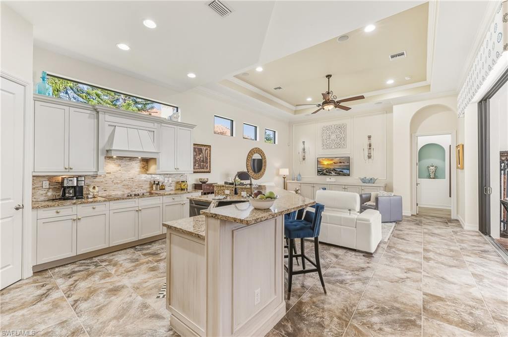 7749 Classics Drive Naples, FL 34113 - Photo 8 of 39 Open Concept view to family room & primary suite