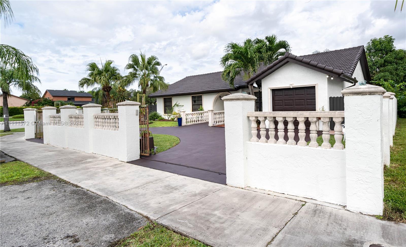 14695 Southwest 45th Street Miami, FL 33175 - Photo 14 of 33 a view of a house with a patio