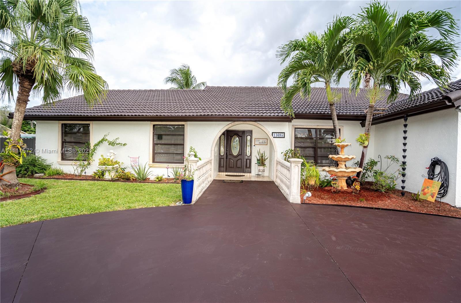14695 Southwest 45th Street Miami, FL 33175 - Photo 17 of 33 a front view of a house with garden