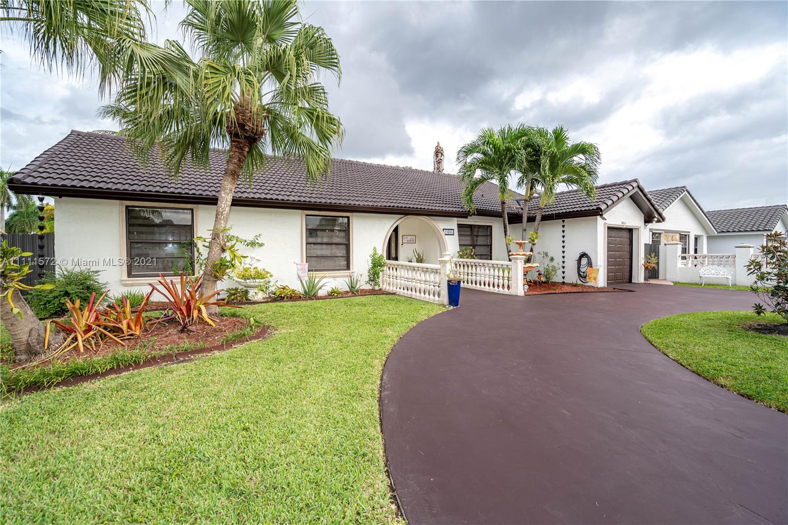 14695 Southwest 45th Street Miami, FL 33175 - Photo 18 of 33 a front view of a house with garden