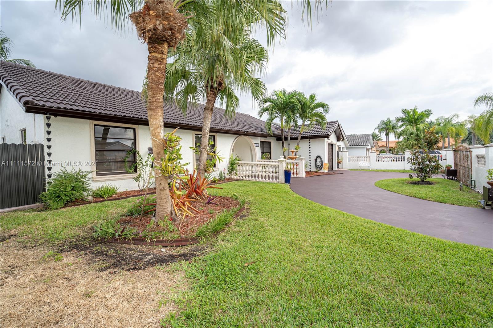 14695 Southwest 45th Street Miami, FL 33175 - Photo 19 of 33 a front view of a house with garden