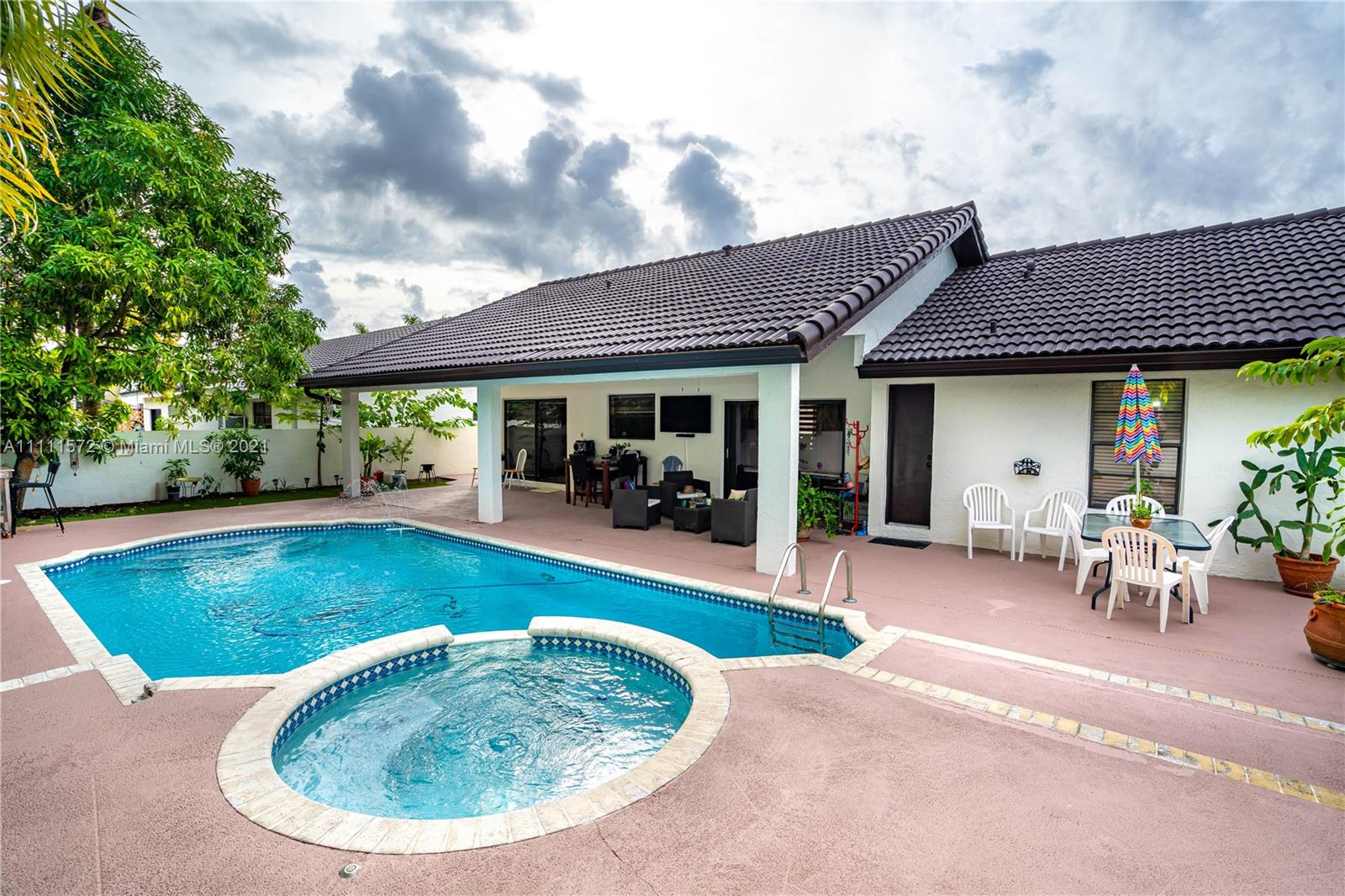 14695 Southwest 45th Street Miami, FL 33175 - Photo 3 of 33 a view of a swimming pool with a patio