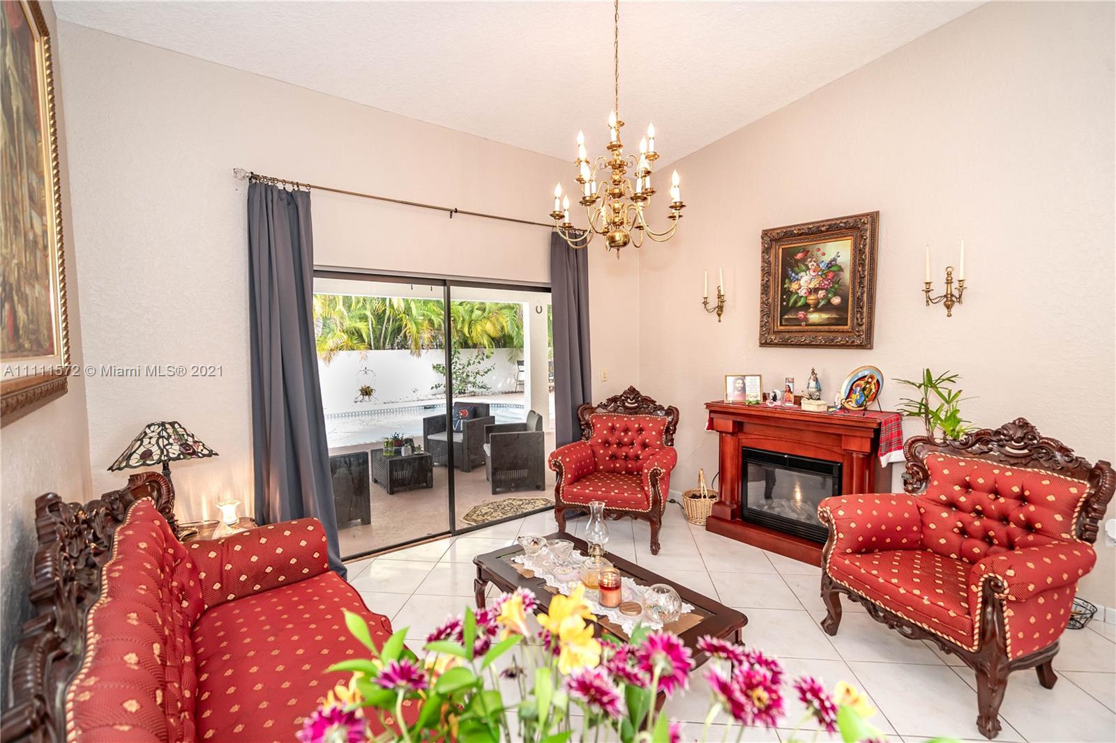 14695 Southwest 45th Street Miami, FL 33175 - Photo 25 of 33 a living room with furniture and a fireplace