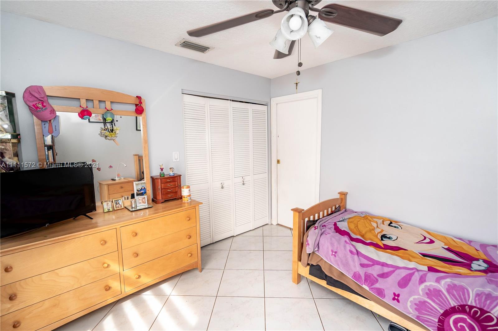 14695 Southwest 45th Street Miami, FL 33175 - Photo 27 of 33 a bedroom with bed and window