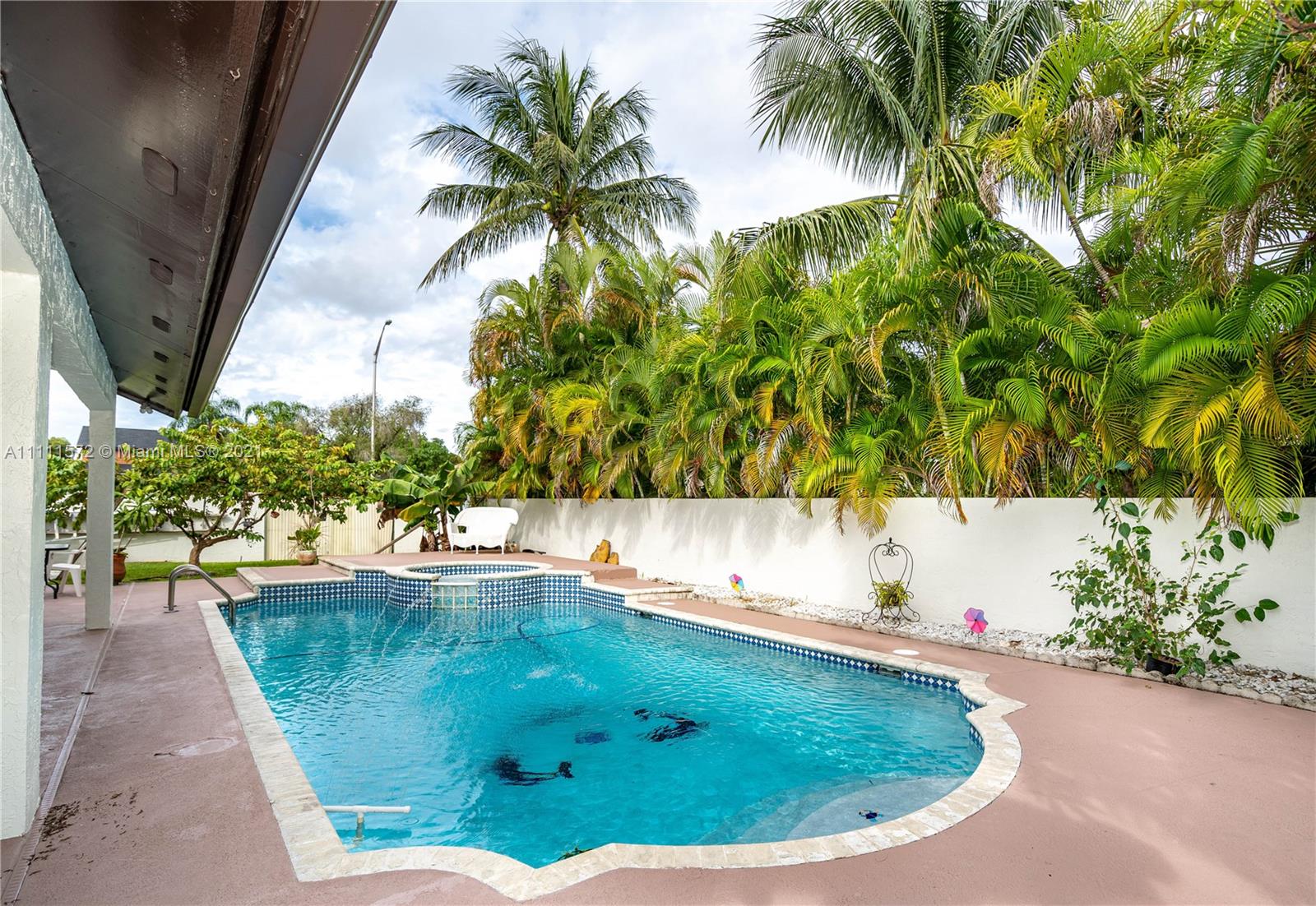 14695 Southwest 45th Street Miami, FL 33175 - Photo 4 of 33 a view of a swimming pool with a yard