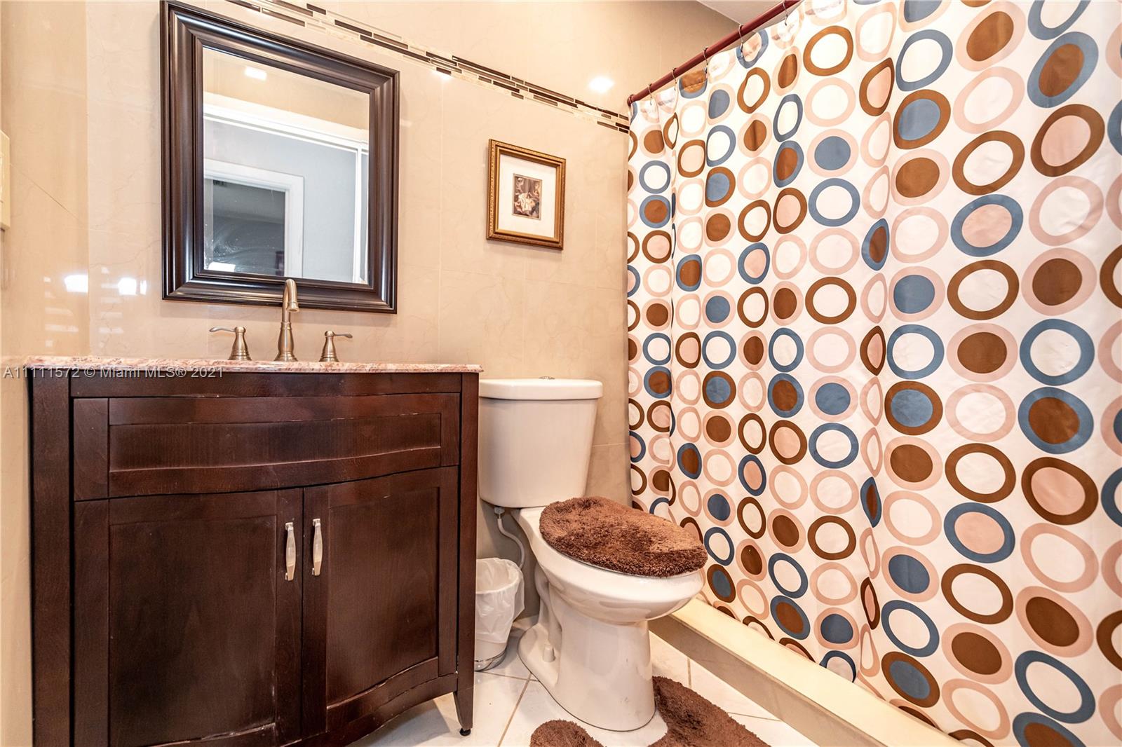 14695 Southwest 45th Street Miami, FL 33175 - Photo 31 of 33 a bathroom with a sink and a mirror