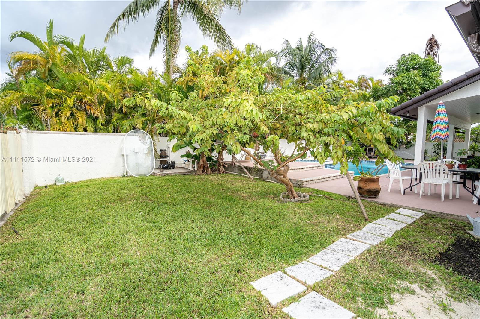 14695 Southwest 45th Street Miami, FL 33175 - Photo 9 of 33 a view of a backyard with sitting area