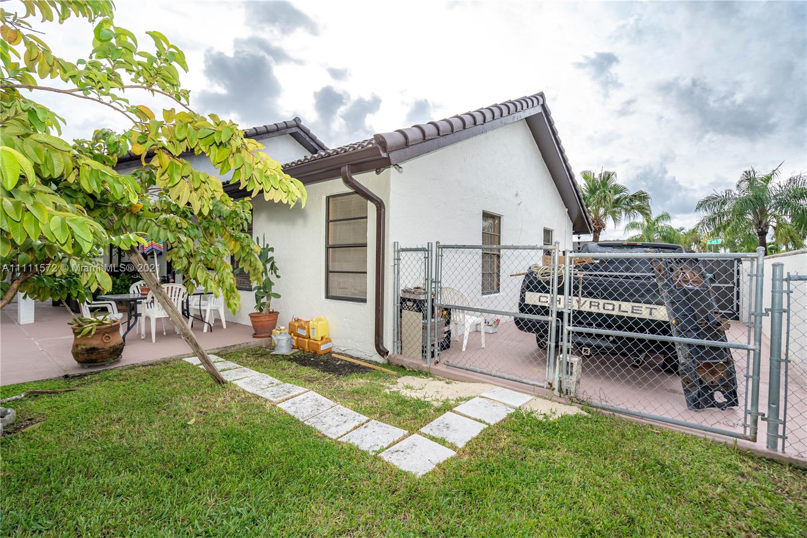 14695 Southwest 45th Street Miami, FL 33175 - Photo 10 of 33 a view of backyard with a garden and outdoor seating