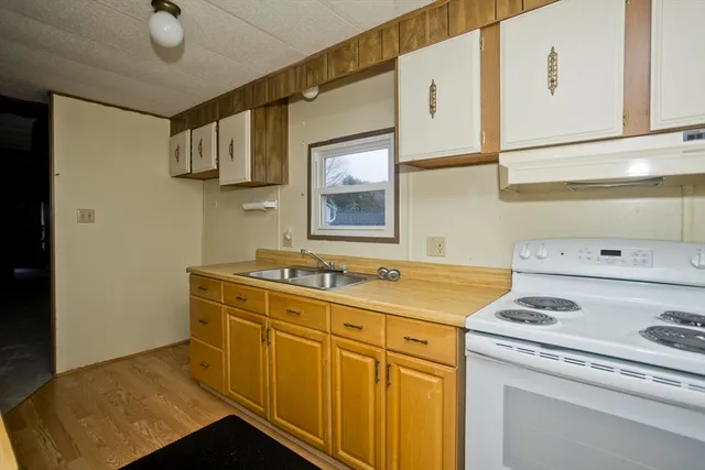 a utility room with sink dryer and washer