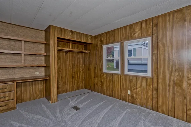 a view of a hallway with a window