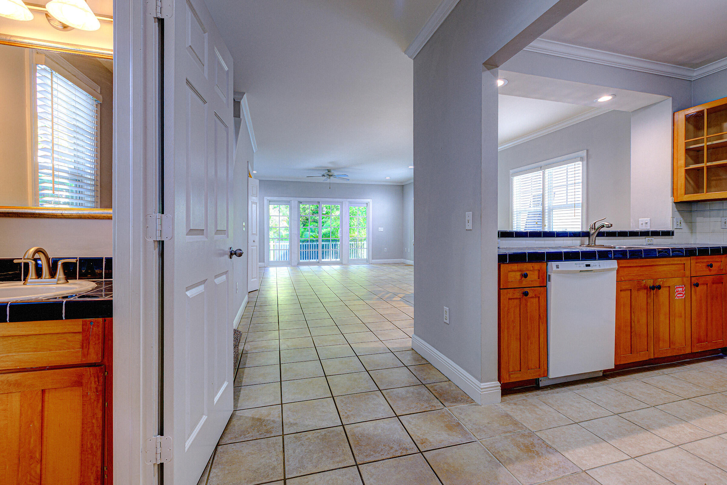 263 Golf Club Drive Key West, FL 33040 - Photo 2 of 30 a kitchen with granite countertop a stove a sink and a refrigerator