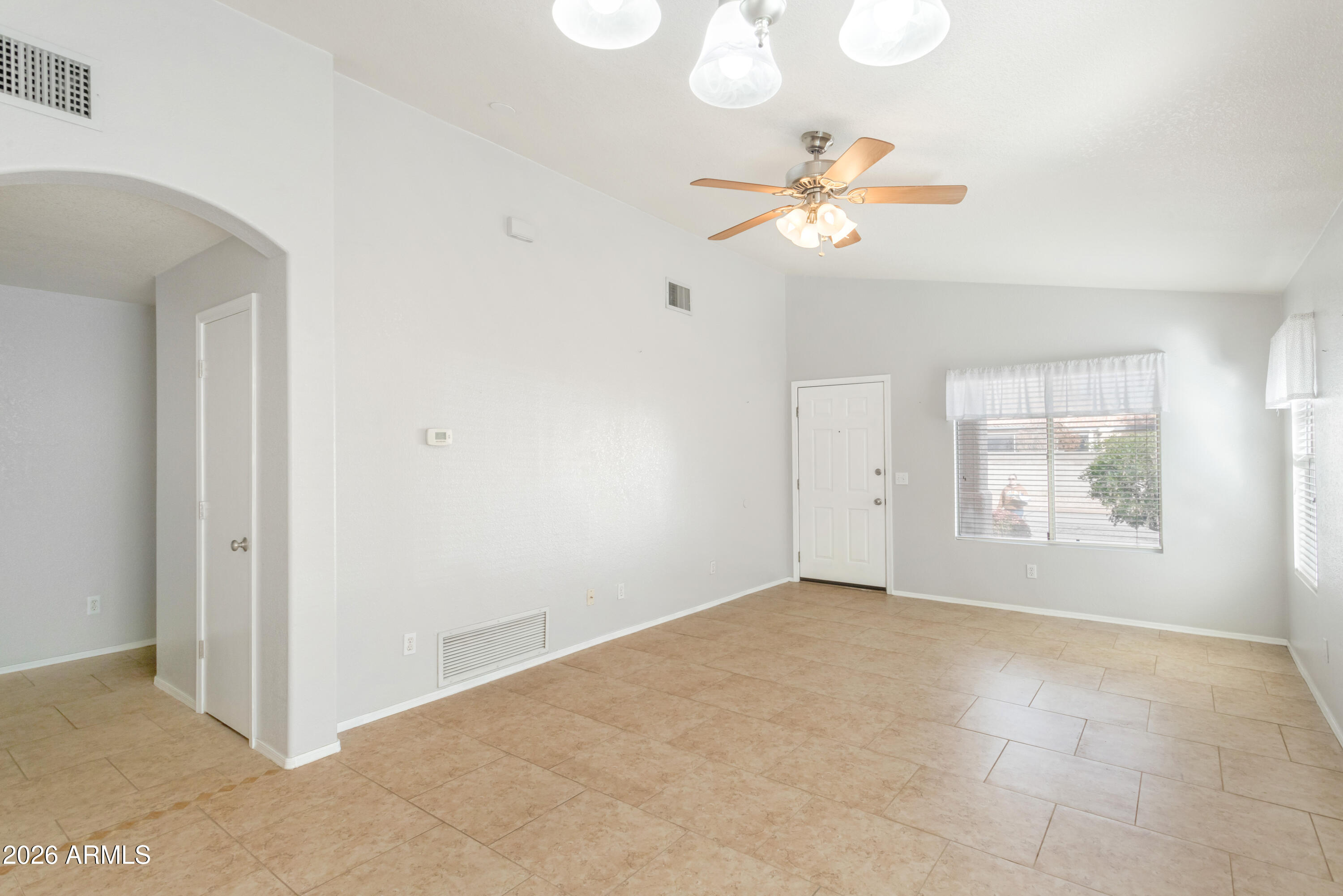 4682 Chaparral Loop Sierra Vista, AZ 85635 - Photo 6 of 28 an empty room with windows and fan