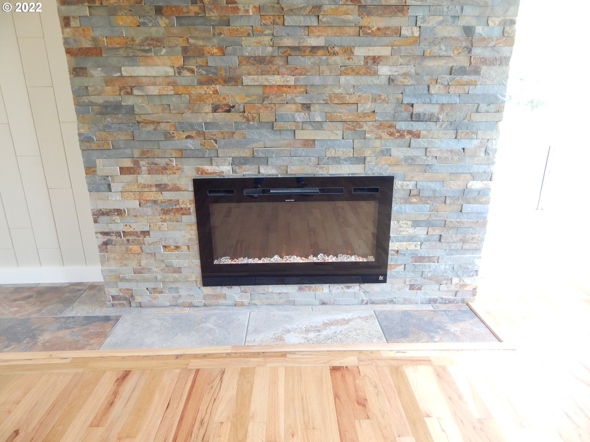39321 Camp Creek Road Springfield, OR 97478 - Photo 9 of 32 a fireplace with a clock on it