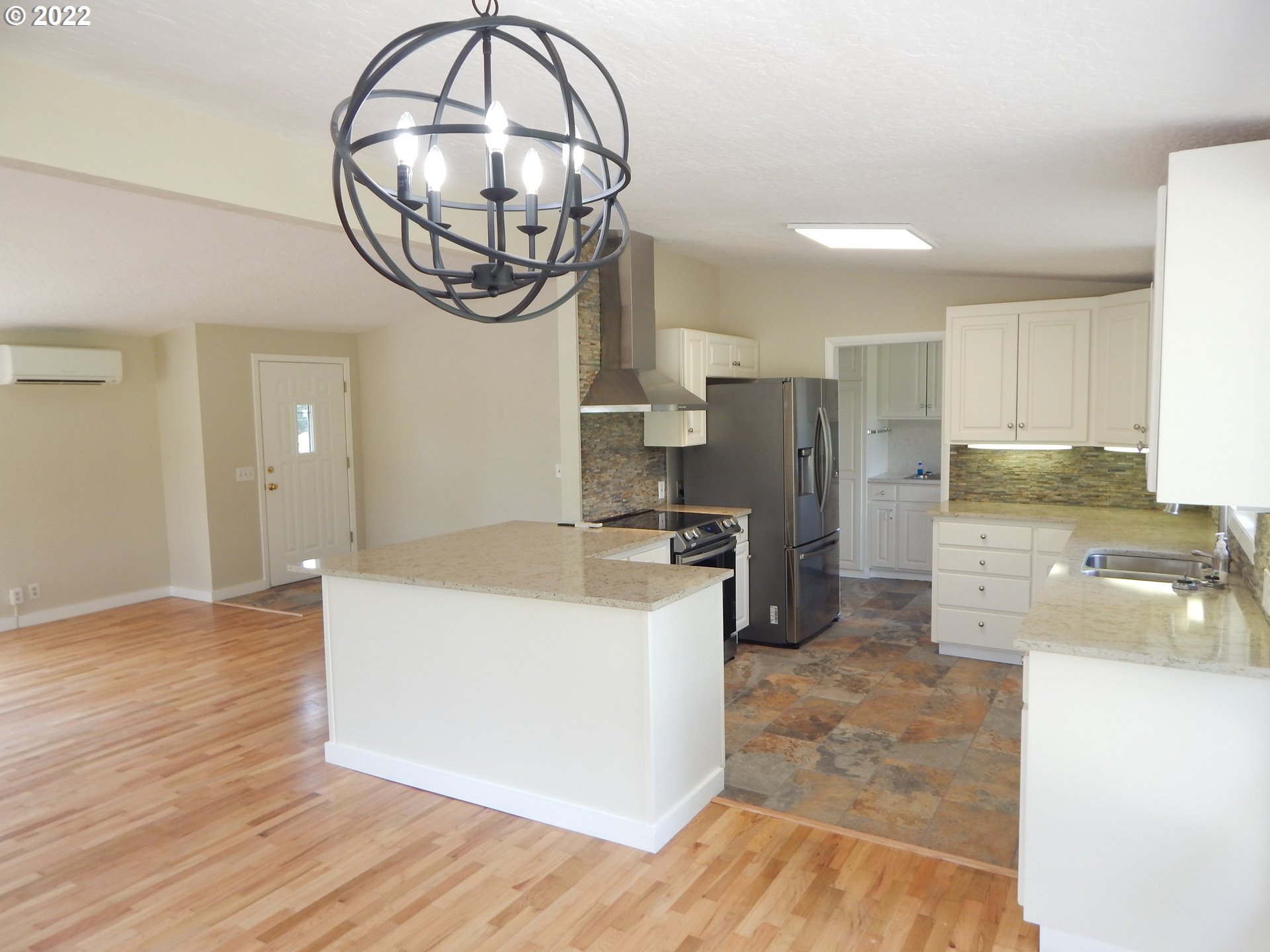 39321 Camp Creek Road Springfield, OR 97478 - Photo 10 of 32 a kitchen with a sink cabinets and stainless steel appliances