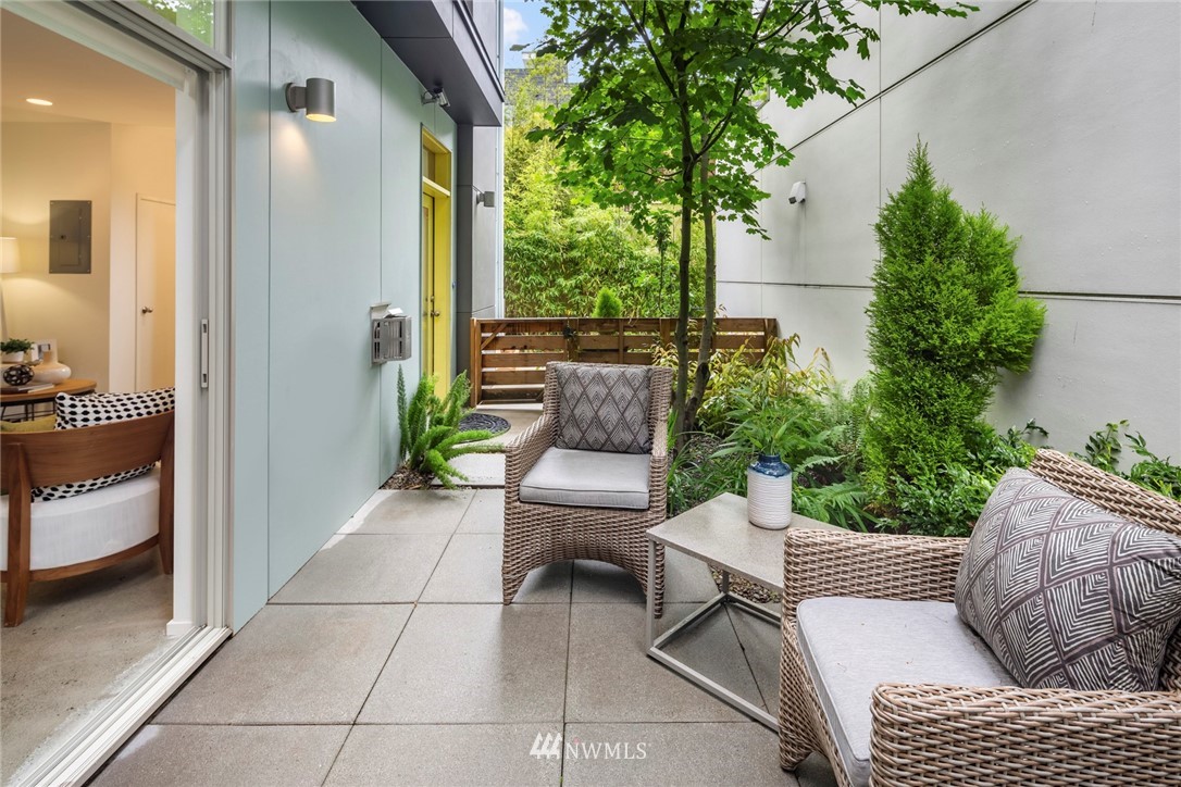 1829 24th Avenue, Unit A Seattle, WA 98122 - Photo 11 of 25 a view of a patio with couches and potted plants