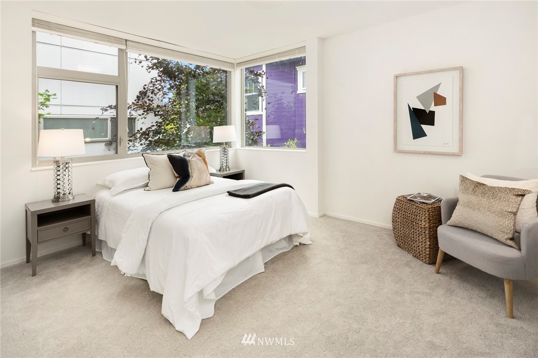 1829 24th Avenue, Unit A Seattle, WA 98122 - Photo 13 of 25 a bedroom with bed and a couch