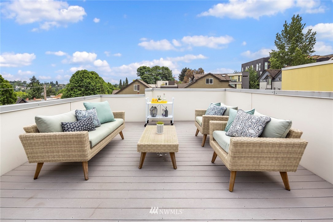 1829 24th Avenue, Unit A Seattle, WA 98122 - Photo 22 of 25 a outdoor living room with patio furniture and a potted plant