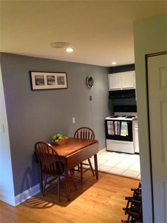 245 Kelton Street, Unit 11 Boston, MA 02134 - Photo 4 of 12 a view of a dining room with furniture and wooden floor
