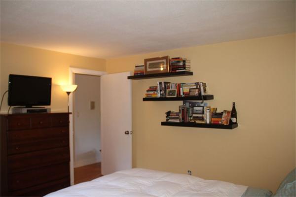 245 Kelton Street, Unit 11 Boston, MA 02134 - Photo 10 of 12 a view of a bedroom with a flat screen tv