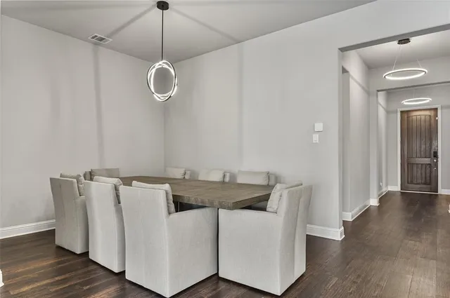 a view of dining room with furniture and wooden floor