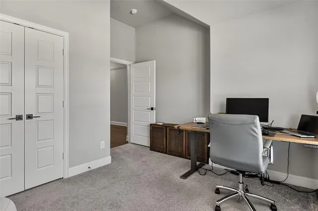 a view of a workspace with furniture