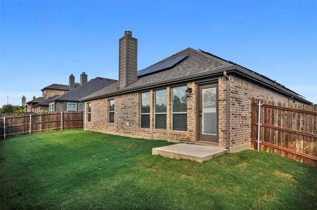 a view of a house with a yard and deck