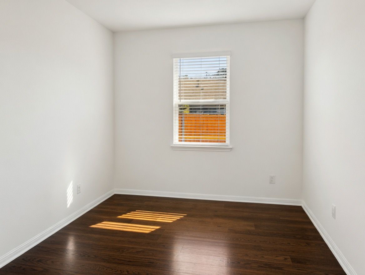 4002 Wynn Road Hutto, TX 78634 - Photo 14 of 29 Spare room with dark wood-style flooring and baseboards