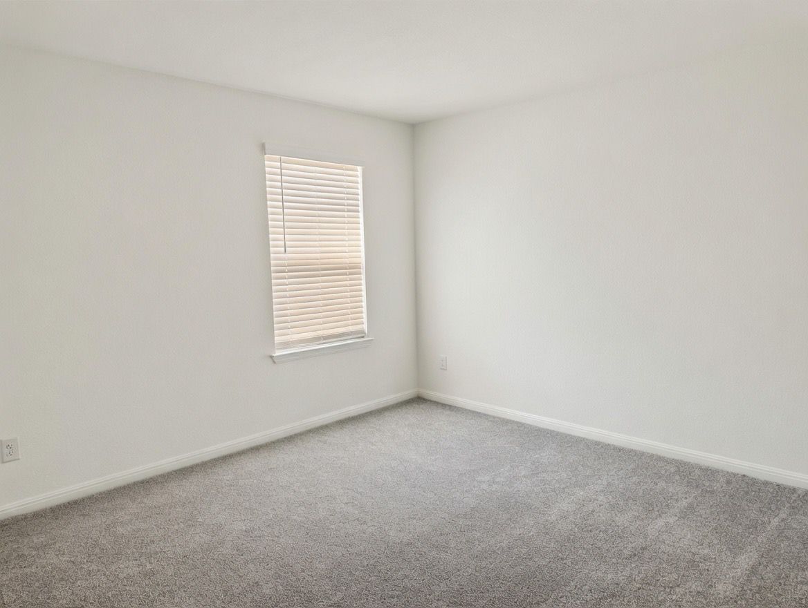 4002 Wynn Road Hutto, TX 78634 - Photo 27 of 29 Spare room with carpet flooring and baseboards