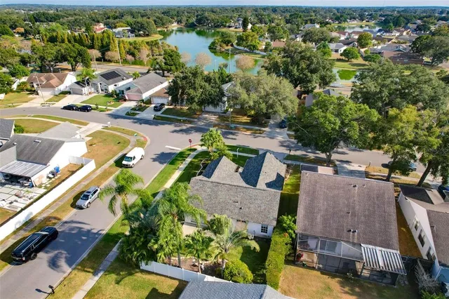 an aerial view of a house with a swimming pool yard and outdoor seating