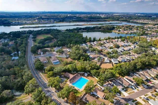 an aerial view of residential building and lake