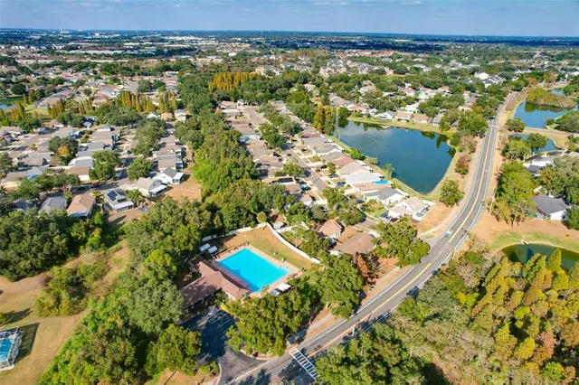 an aerial view of a house with a yard and garden
