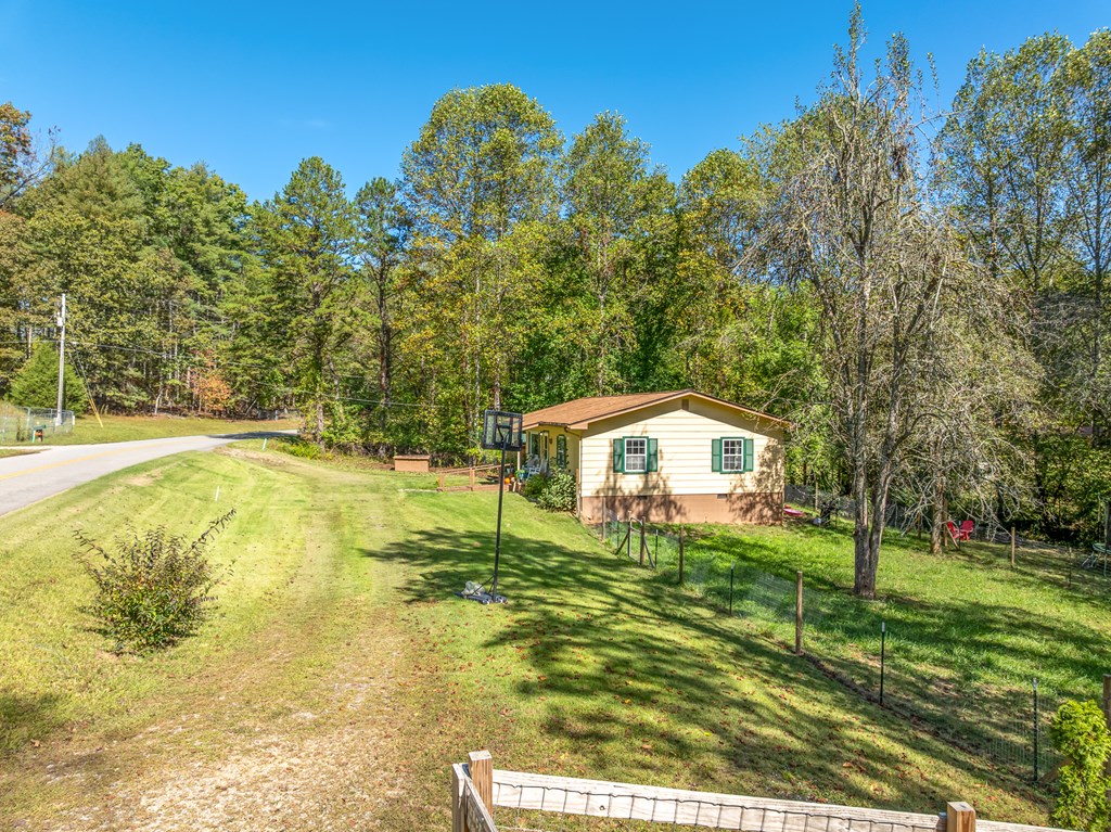 1813 John Smith Road East Blairsville, GA 30512 - Photo 33 of 41 a house with swimming pool in front of it