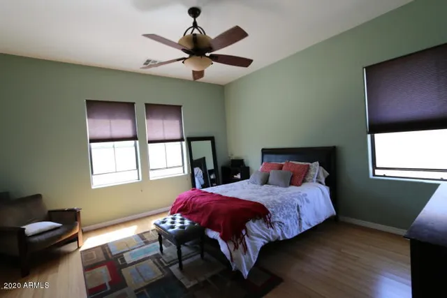 a bedroom with a bed and a window