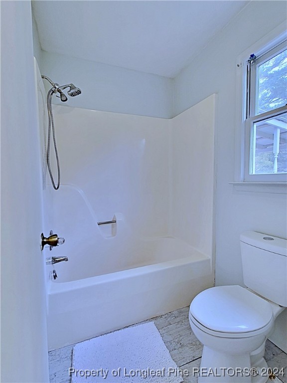 210 Cypress Road Cameron, NC 28326 - Photo 24 of 50 a white toilet sitting next to a bath tub