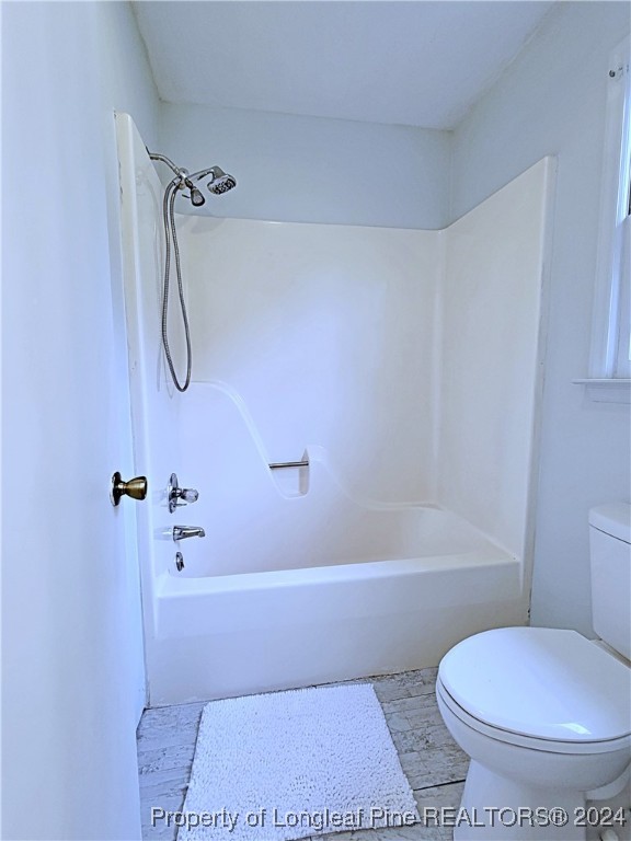 210 Cypress Road Cameron, NC 28326 - Photo 25 of 50 a bathroom with a toilet and a bath tub