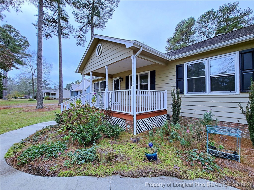 210 Cypress Road Cameron, NC 28326 - Photo 37 of 50 a front view of a house with garden