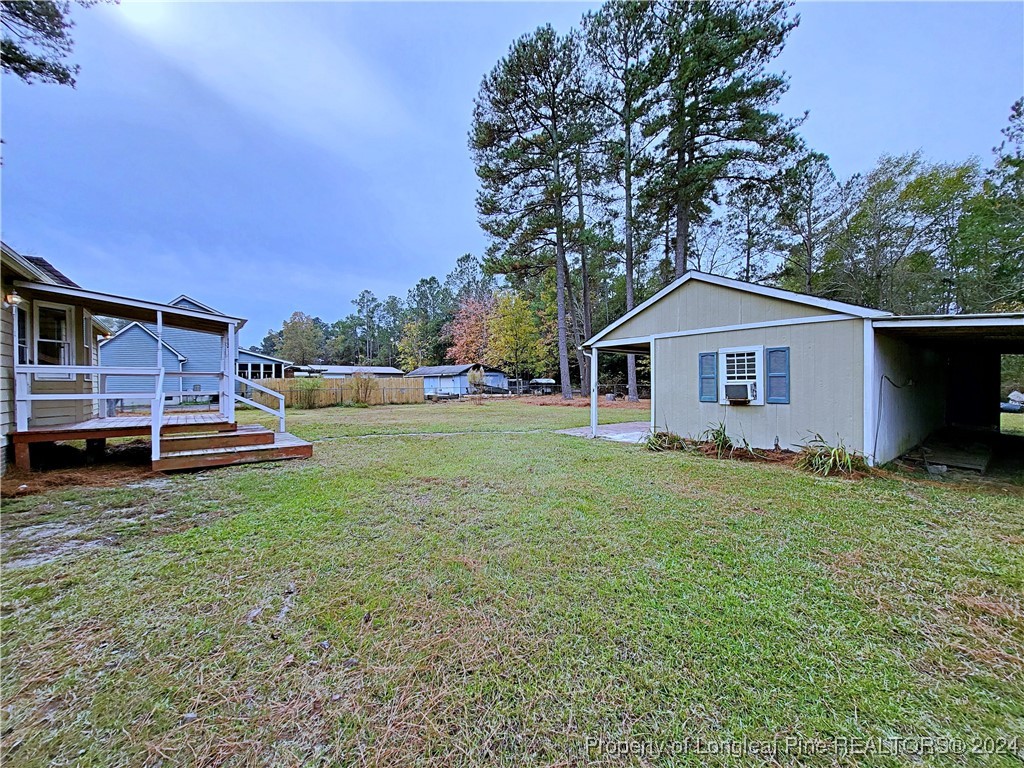 210 Cypress Road Cameron, NC 28326 - Photo 44 of 50 a front view of a house with garden