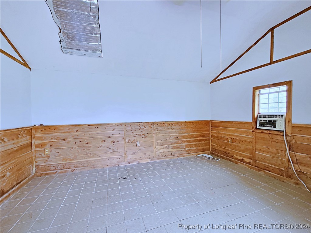 210 Cypress Road Cameron, NC 28326 - Photo 48 of 50 a view of a kitchen with an empty space and wooden floor