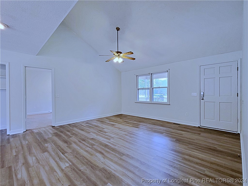 210 Cypress Road Cameron, NC 28326 - Photo 5 of 50 a view of empty room with wooden floor and fan